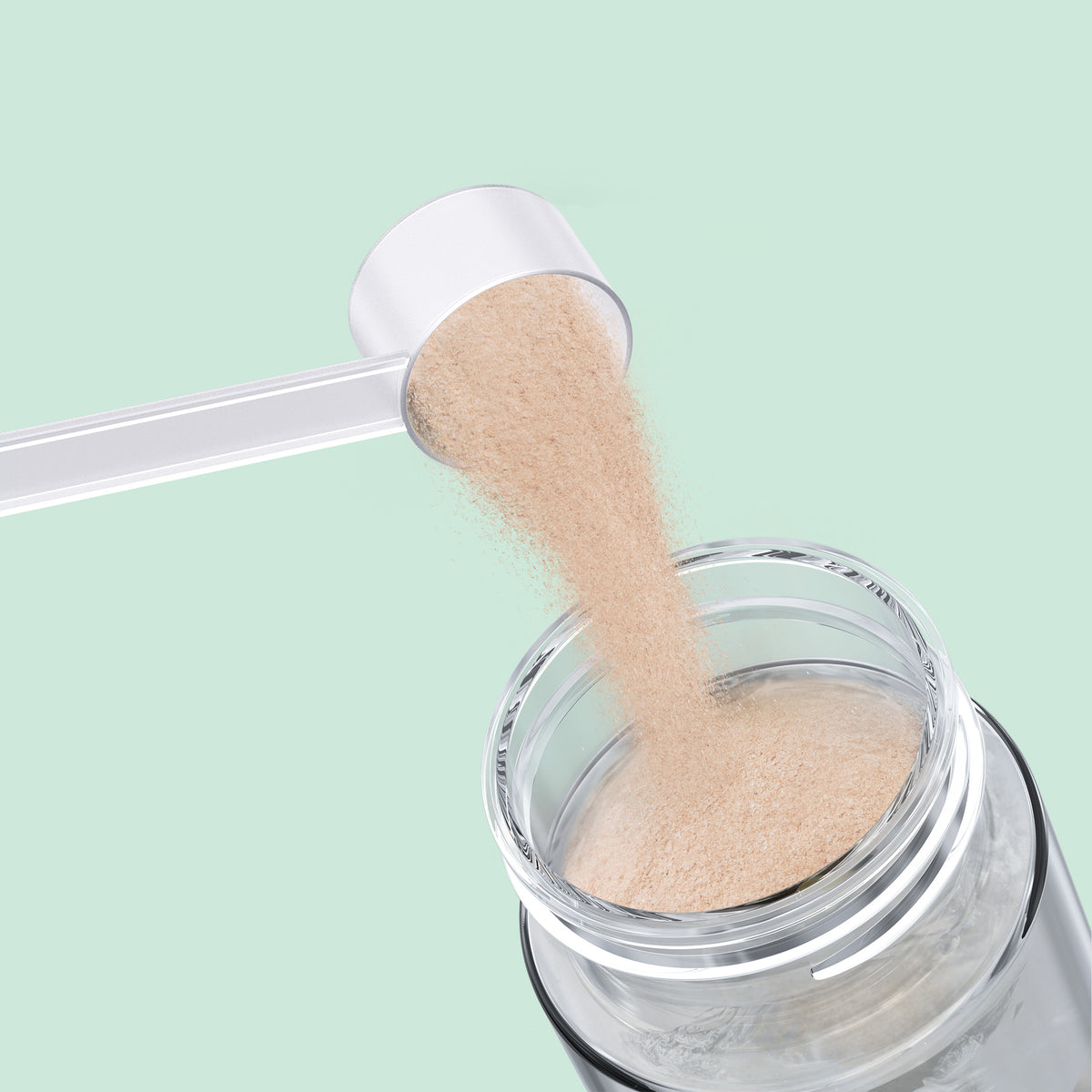 Qallo Energy Lemon Lime tub: scoop of powder poured into a bottle