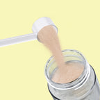 Qallo Hydration Lemon tub: scoop of powder poured into a bottle