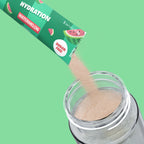 Qallo Hydration Watermelon sachets: sachet poured into a bottle