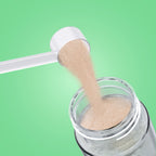 Qallo Hydration Watermelon tub: scoop of powder poured into a bottle