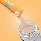 Qallo Vitamins Orange sachets: sachet poured into a bottle