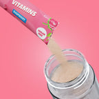 Qallo Vitamins Raspberry sachets: sachet poured into a bottle
